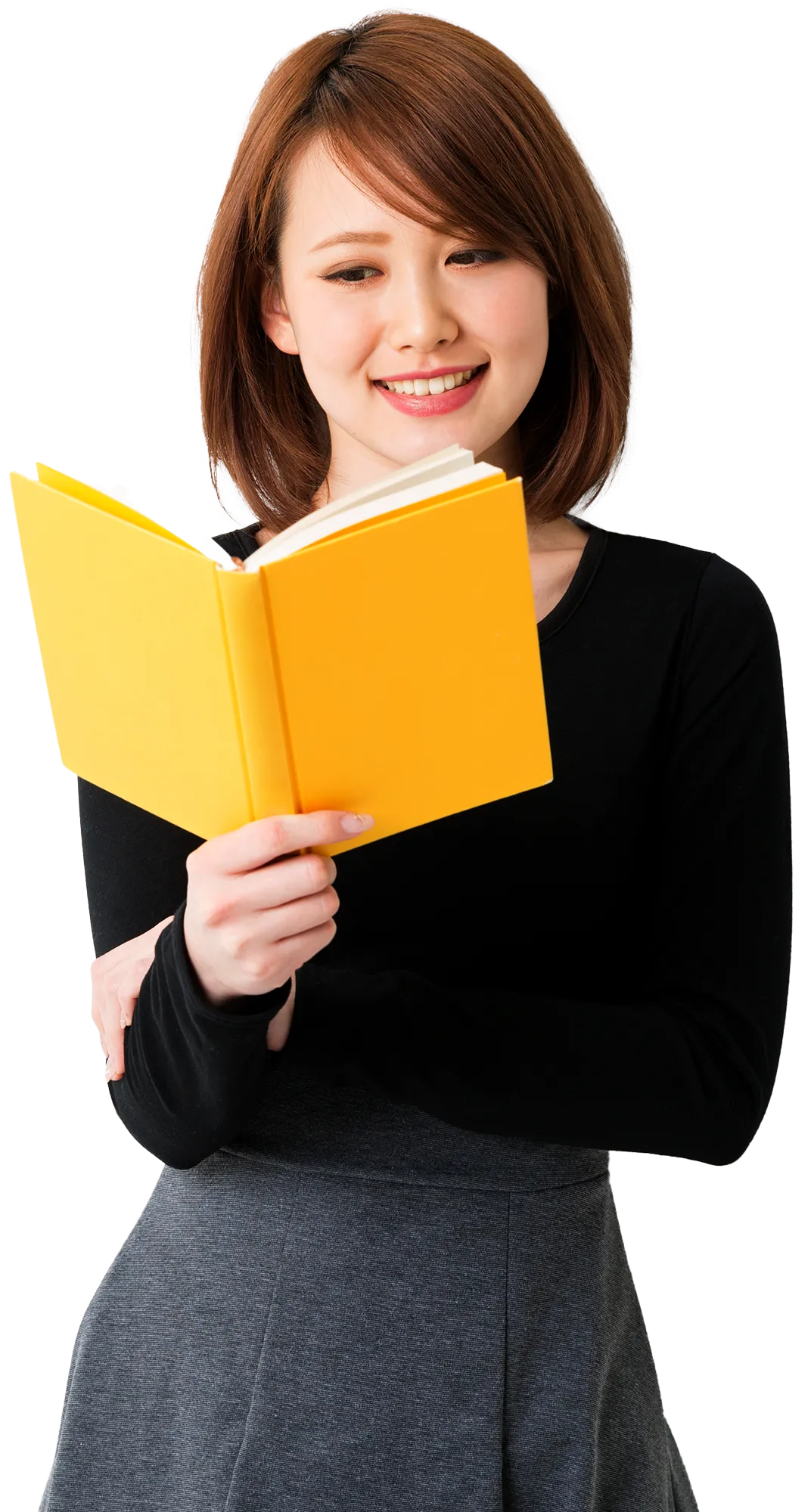 asian woman reading book with yellow cover